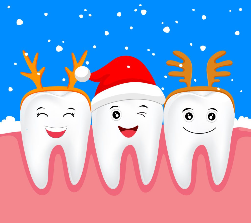 Cartoon of three smiling teeth donned in Santa cap and reindeer antlers